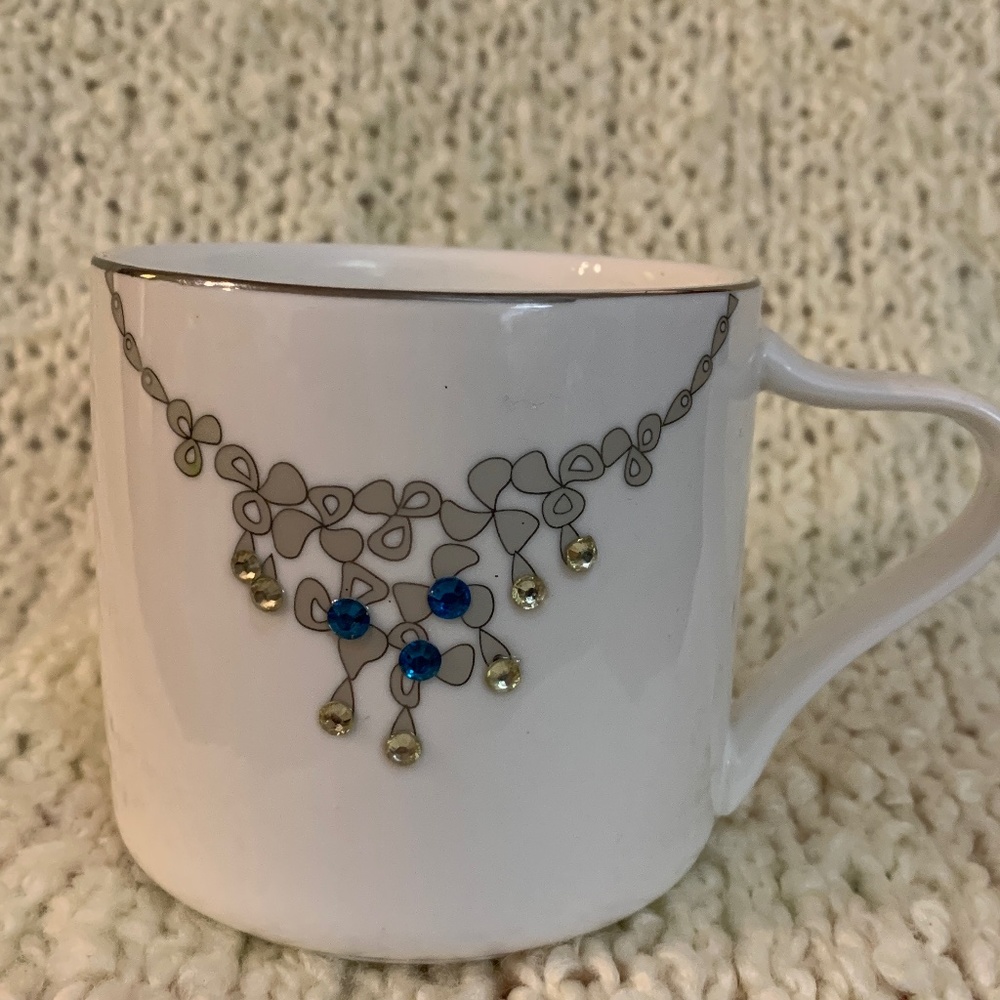 Verdici jewelled mug withh rhinestones on it.